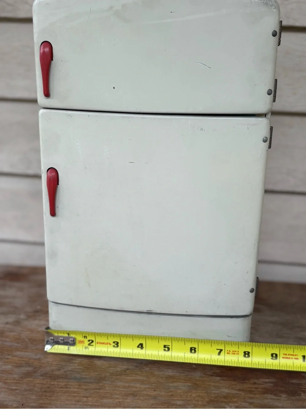 VTG 1950s Wolverine Supply metal toy refrigerator, featuring a white finish
